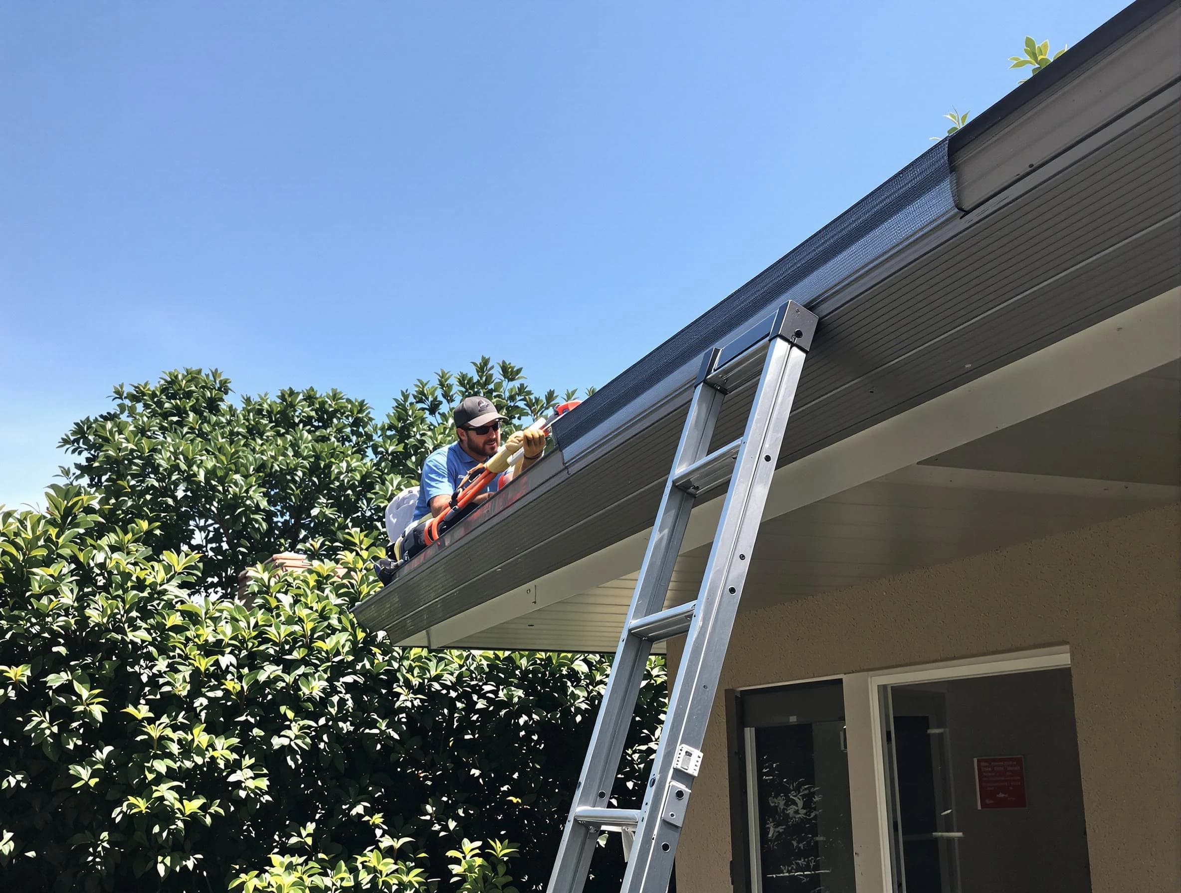 Medina Roofing Company installing gutter guards for a homeowner in Medina, OH